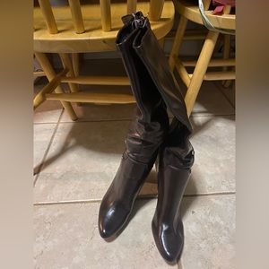 Brown! Never worn pair of high heels boots.